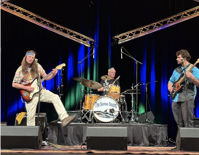 The Somes Sound playing on a stage
